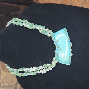BEACHY DOUBLE STRANDED NWCKLACE FEATURING TURQUOISE COLORED BEADS AND SHELLS